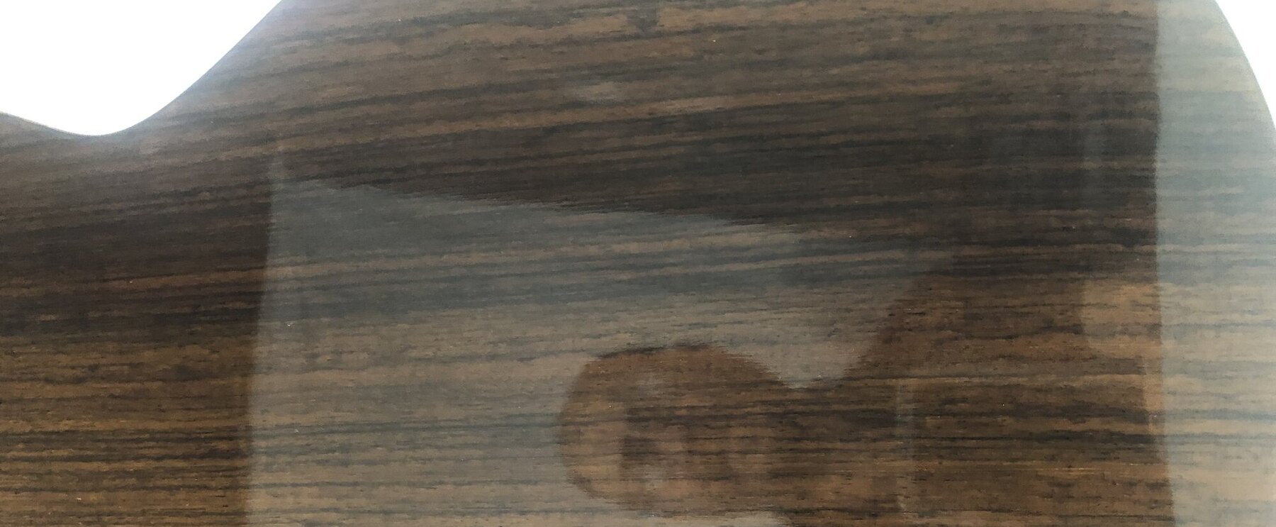 Figured timber back of a Doriean classical guitar showing the grain